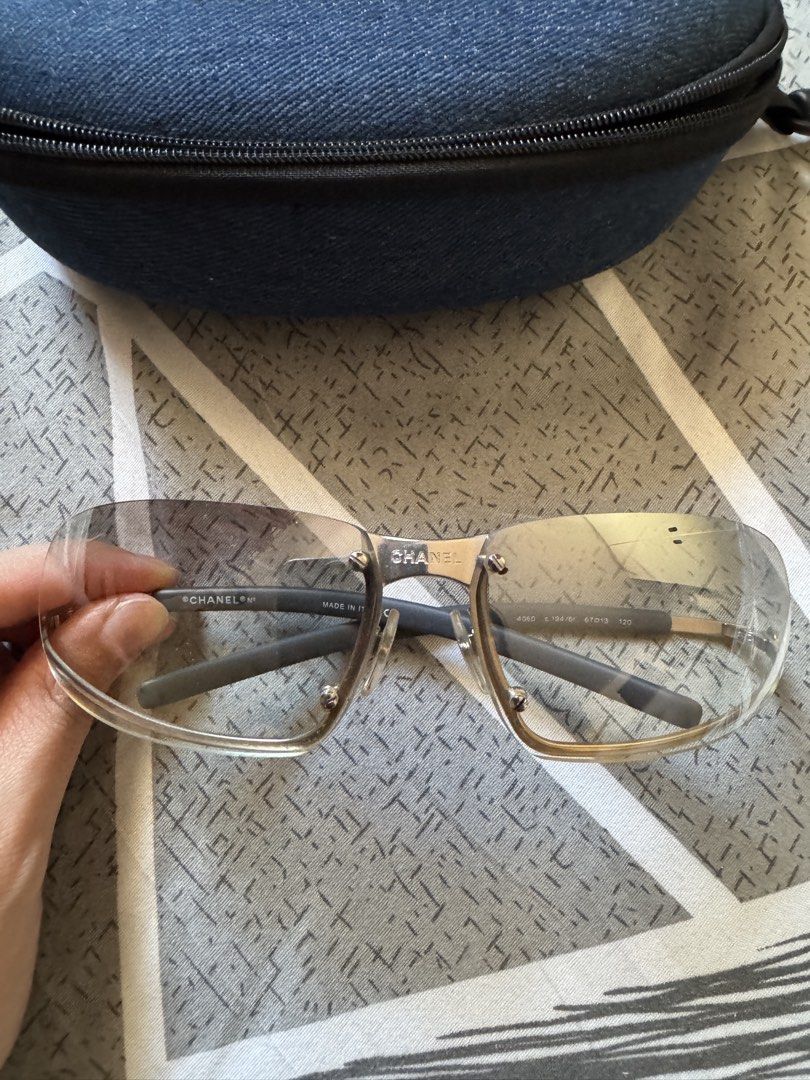 Authentic 2000s Chanel 4060 Sunglasses with Case (Category: Sunglasses & Eyewear) located in Paranaque City. Submitted by matildascatalog (Listing ID 1468102917, Image 3). Description: - Authentic Chanel sunglasses (Model: 4060, Color: c.194/61) - purchased from Japan thrift - reflective metallic silver frame - Iconic 'CC' logo detail on the temple hinges - Made in Italy with engraved serial numbers - Generic case included - Condition: Has 1 scra