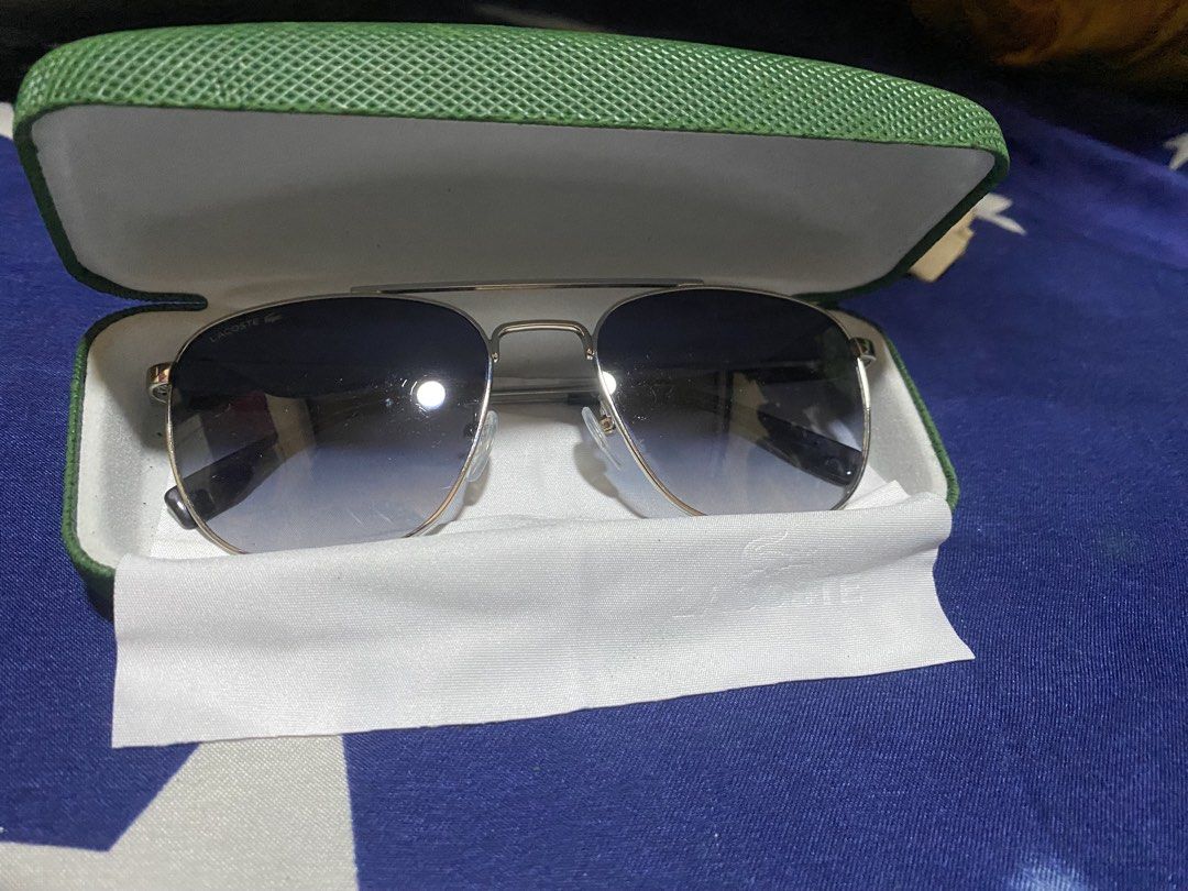 Authentic Aviator Lacoste SunGlass (Category: Sunglasses & Eyewear) located in Bulacan. Submitted by httpsthrift (Listing ID 1468231598, Image 3). Description: Includes Lacoste Case and Lacoste Wipes rfs decluttering .