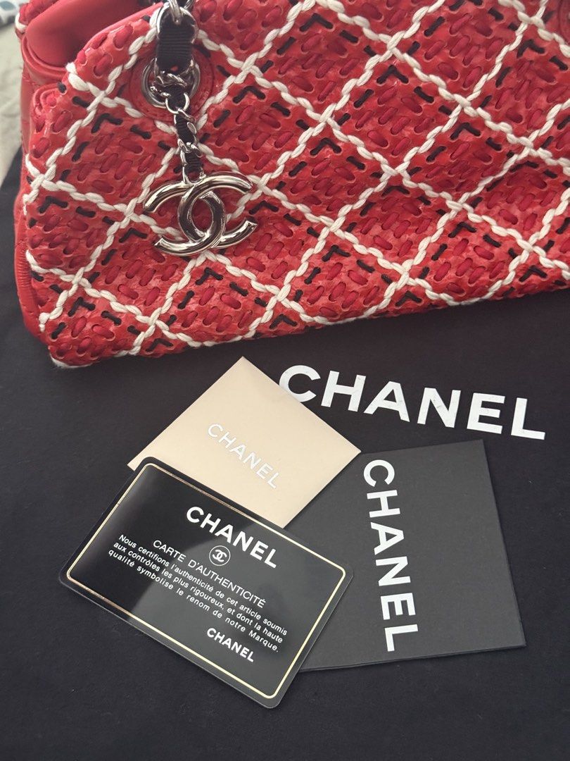 Authentic Chanel Red Woven Chain Shoulder Bag (Category: Shoulder Bags) located in Manila. Submitted by happywhale-0f64 (Listing ID 1468156420, Image 3). Description: - Brand: Chanel - Style: Shoulder bag - Material: Bright red woven fabric with white stitching in a diamond quilt pattern - Hardware: Silver-tone with woven chain straps and hanging CC charm - Closure: Secure zippered top - Inclusions: Dust bag and authenticity card included - Condi