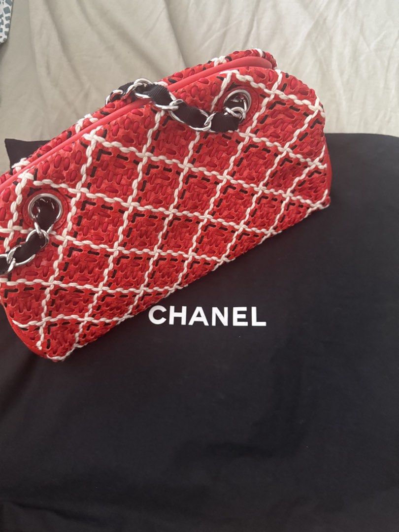 Authentic Chanel Red Woven Chain Shoulder Bag (Category: Shoulder Bags) located in Manila. Submitted by happywhale-0f64 (Listing ID 1468156420, Image 1). Description: - Brand: Chanel - Style: Shoulder bag - Material: Bright red woven fabric with white stitching in a diamond quilt pattern - Hardware: Silver-tone with woven chain straps and hanging CC charm - Closure: Secure zippered top - Inclusions: Dust bag and authenticity card included - Condi