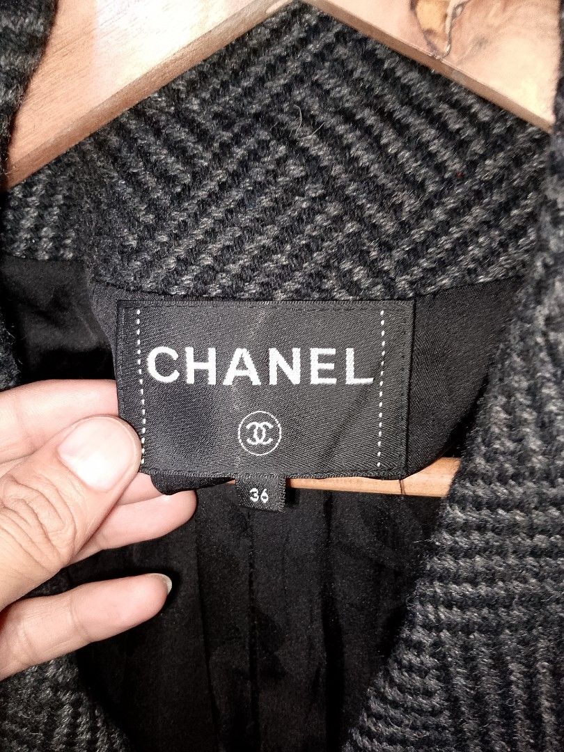 Authentic Chanel Tweed Wool Blazer Jacket Size 36 (Category: Coats, Jackets and Outerwear) located in Manila. Submitted by mjthrifted_second (Listing ID 1468092290, Image 3). Description: - Authentic Chanel blazer in dark grey and black herringbone tweed - Size 36 (160/84 A), made in France - 100% wool exterior with luxurious silk lining - Features a structured collar, front button closure, and four patch pockets with stunning jewel-embellished b