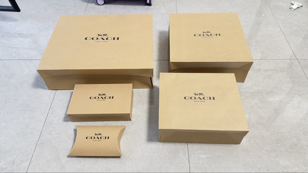 Authentic Coach Gift Boxes Various Sizes (Category: Accessory Holder, Box & Organizers) located in Quezon City. Submitted by dendionlineshop (Listing ID 1468155589, Image 3). Description: Big box - 250 Large - 200 Medium - 150 Small - 100 - Authentic Coach gift boxes in assorted sizes and shapes - Includes both flat pillow boxes and standard lidded boxes - Classic brown cardboard finish with iconic Coach New York logo - Perfect for gifting, organ