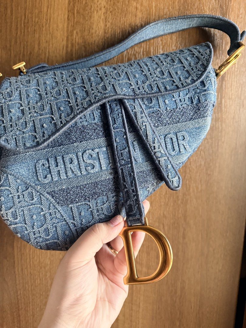 Authentic Dior Blue Oblique Denim Saddle Bag (Category: Luxury Bags & Wallets) located in Antipolo. Submitted by SummerPeaCloset (Listing ID 1468204194, Image 3). Description: The Dior Saddle made a huge comeback in 2018 and it has gone on to remain in style. Just for you to catch on with the Saddle trend comes this gorgeous version in Oblique denim. A single handle and a fabric interior sum the creation up. The bag gives off a modern vibe, but t