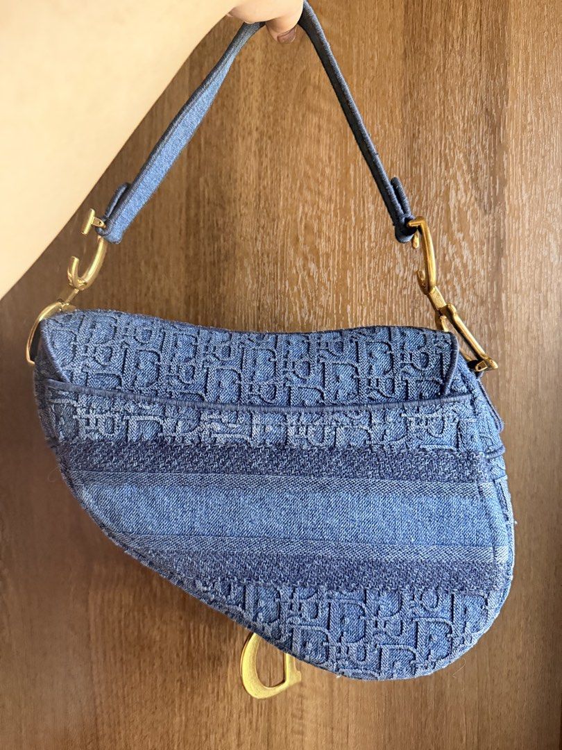 Authentic Dior Blue Oblique Denim Saddle Bag (Category: Luxury Bags & Wallets) located in Antipolo. Submitted by SummerPeaCloset (Listing ID 1468204194, Image 2). Description: The Dior Saddle made a huge comeback in 2018 and it has gone on to remain in style. Just for you to catch on with the Saddle trend comes this gorgeous version in Oblique denim. A single handle and a fabric interior sum the creation up. The bag gives off a modern vibe, but t