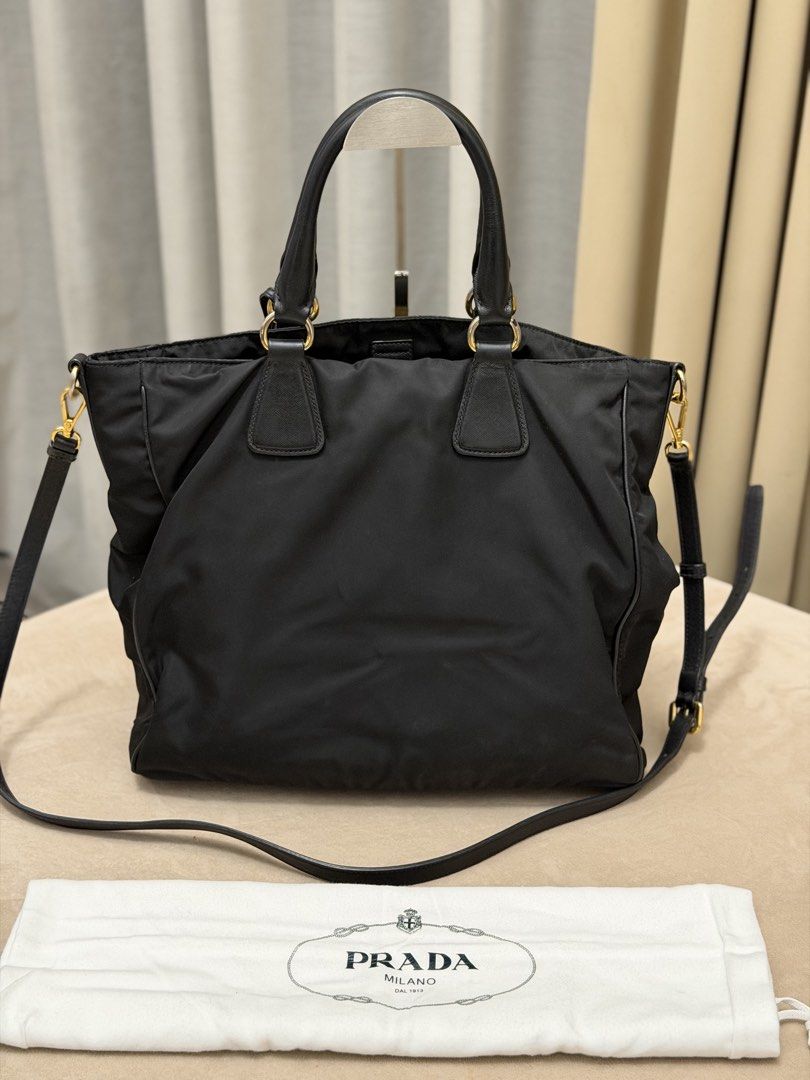 Authentic Prada Tessuto Nylon Black Tote Bag (Category: Tote Bags) located in Manila. Submitted by maria_2326 (Listing ID 1464943628, Image 2). Description: 💯% Authentic W/ dust bag and long strap No lowballing! Location: Manila/QC.