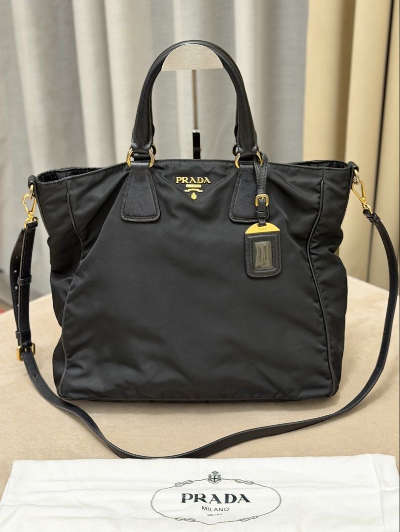 Authentic Prada Tessuto Nylon Black Tote Bag (Category: Tote Bags) located in Manila. Submitted by maria_2326 (Listing ID 1464943628, Image 1). Description: 💯% Authentic W/ dust bag and long strap No lowballing! Location: Manila/QC.
