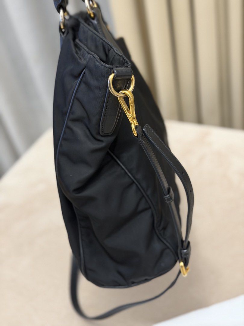 Authentic Prada Tessuto Nylon Black Tote Bag (Category: Tote Bags) located in Manila. Submitted by maria_2326 (Listing ID 1464943628, Image 3). Description: 💯% Authentic W/ dust bag and long strap No lowballing! Location: Manila/QC.