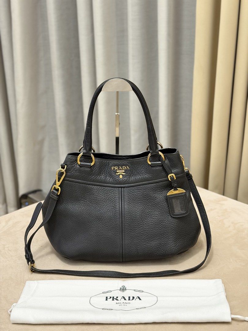 Authentic Prada Vitello Daino Small Two-way Bag (Category: Shoulder Bags) located in Manila. Submitted by maria_2326 (Listing ID 1468068816, Image 1). Description: 💯% Authentic W/dust bag and long strap No lowballing Location: Manila/QC.