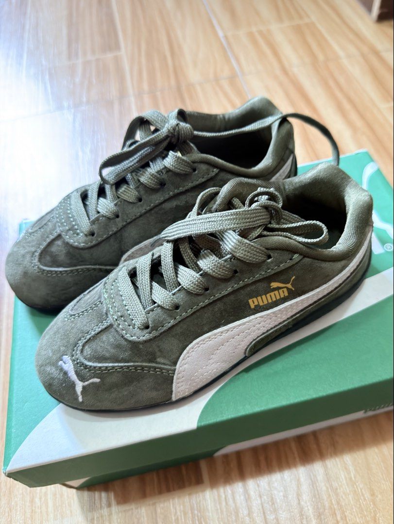 Authentic Puma Speedcat Green Suede Sneakers (Category: Babies & Kids Fashion) located in Butuan. Submitted by itsmel2624 (Listing ID 1468090941, Image 2). Description: - Brand: Puma - Color: Olive green with white side stripe - Material: Premium suede with matching laces - Details: Gold logo lettering and white embroidered cat logo on the toe tip Size 12C.