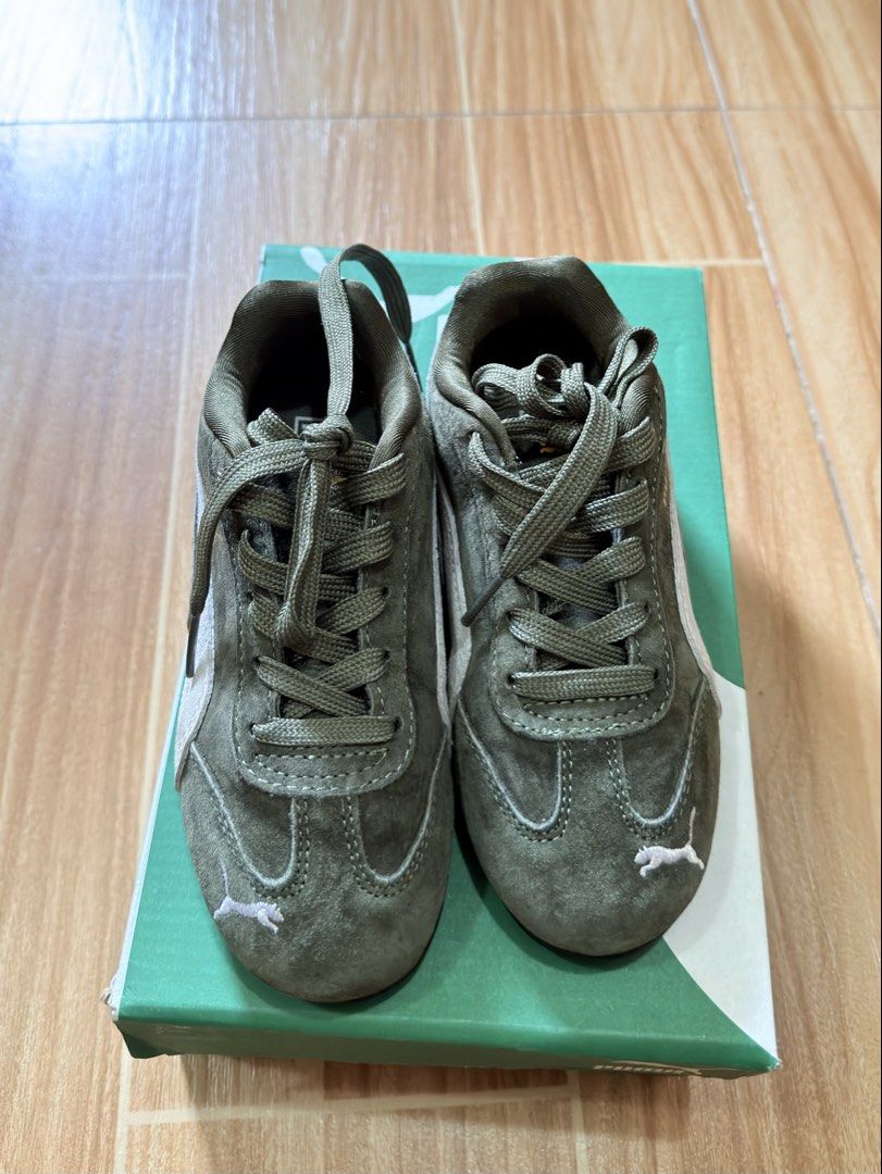 Authentic Puma Speedcat Green Suede Sneakers (Category: Babies & Kids Fashion) located in Butuan. Submitted by itsmel2624 (Listing ID 1468090941, Image 1). Description: - Brand: Puma - Color: Olive green with white side stripe - Material: Premium suede with matching laces - Details: Gold logo lettering and white embroidered cat logo on the toe tip Size 12C.