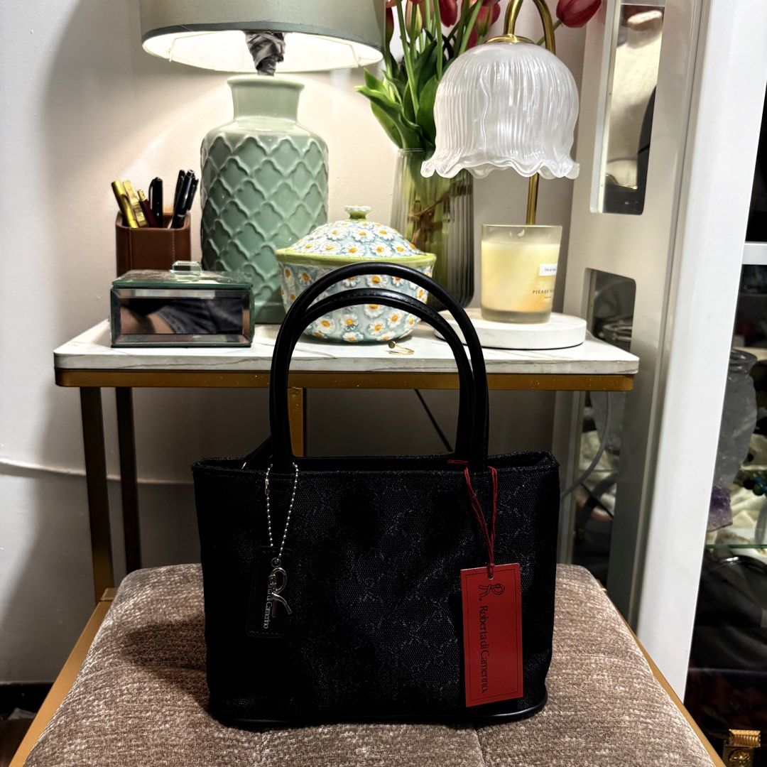 Authentic Roberta de Camerino Black Monogram Top handle Black Bag (Category: Purses & Pouches) located in Binangonan. Submitted by makoleksyon (Listing ID 1468231396, Image 1). Description: Brand new Complete with tags Pwede pang gift Ang cute ng size pero marami nalalagay Size: H-6 -x W-9.5 x D-3 inches Bought in Japan 💯% Authentic Money back guarantee .