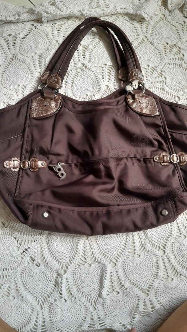 Authentic TOUS Brown Nylon & Leather Tote Bag (Category: Shoulder Bags) located in Manila. Submitted by jocelyn527 (Listing ID 1468110529, Image 2). Description: 💯 Authentic TOUS Brown Nylon & Leather Tote Bag ✨ PERFECT FOR EVERY OCCASION: 👩‍💼 Work & Office — Fits your laptop, documents, wallet, and essentials — looks professional and polished 📚 School & College — Lightweight yet durable — spacious enough for notebooks, books, and daily items