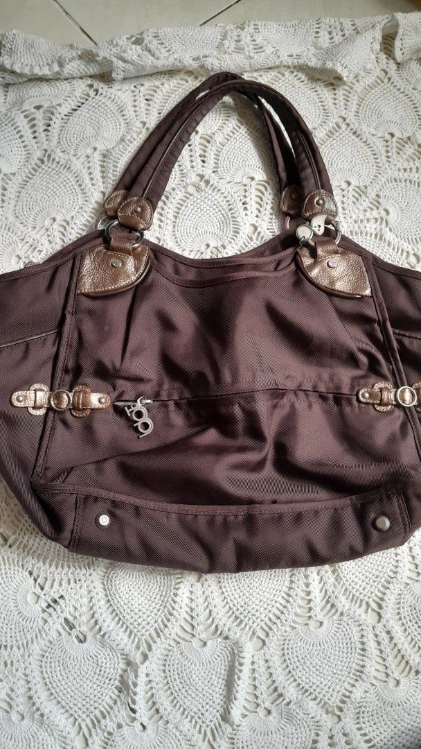 Authentic TOUS Brown Nylon & Leather Tote Bag (Category: Shoulder Bags) located in Manila. Submitted by jocelyn527 (Listing ID 1468110529, Image 1). Description: 💯 Authentic TOUS Brown Nylon & Leather Tote Bag ✨ PERFECT FOR EVERY OCCASION: 👩‍💼 Work & Office — Fits your laptop, documents, wallet, and essentials — looks professional and polished 📚 School & College — Lightweight yet durable — spacious enough for notebooks, books, and daily items