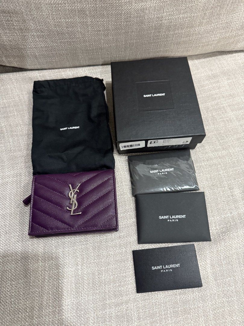 Authentic YSL Cassandre wallet (Category: Wallets & Card holders) located in Manila. Submitted by echipmunk (Listing ID 1468169277, Image 1). Description: 100% authentic almost new YSL wallet in purple Used for half a day then stored COMPLETE - with box, tags, care card and dust bag RFS not used to small wallets SLIGHTLY NEGOTIABLE!!! Will block low ballers 🙏🏻.