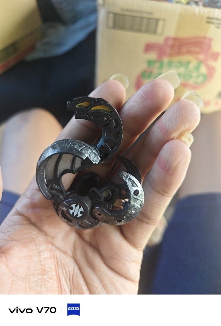 Bakugan Haos Hydranoid Darkus Bakugan Toy (Category: Action & Battle Toys) located in Kapangan. Submitted by ClumZyDale (Listing ID 1468082867, Image 2). Description: - Item: Black and Silver Bakugan Collectible Toy - Power Level: 790G printed on the side - Design: Dragon-snake head with striking yellow eyes and center attribute symbol - Condition: Loose, sold as-is without original packaging - Perfect for: Classic battle game fans and toy collec
