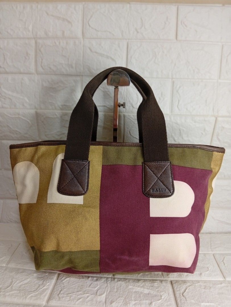 Bally Multicolor Canvas Tote Bag (Category: Tote Bags) located in Las Pinas. Submitted by etoksi1234 (Listing ID 1468065169, Image 1). Description: Pre-loved Bally Multicolor Canvas Tote Bag featuring a geometric color-block pattern (often called the Boothbay or geometric B-logo design) with brown canvas double top handles and leather trim. Made in Switzerland..