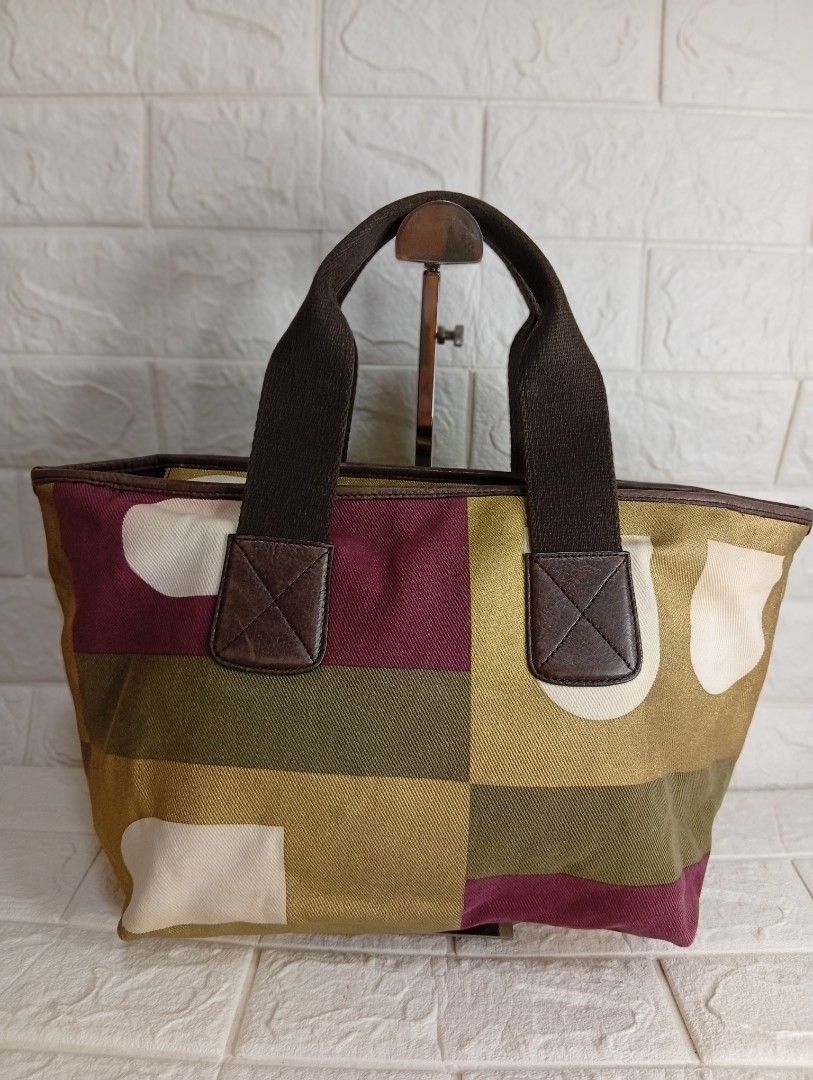 Bally Multicolor Canvas Tote Bag (Category: Tote Bags) located in Las Pinas. Submitted by etoksi1234 (Listing ID 1468065169, Image 2). Description: Pre-loved Bally Multicolor Canvas Tote Bag featuring a geometric color-block pattern (often called the Boothbay or geometric B-logo design) with brown canvas double top handles and leather trim. Made in Switzerland..