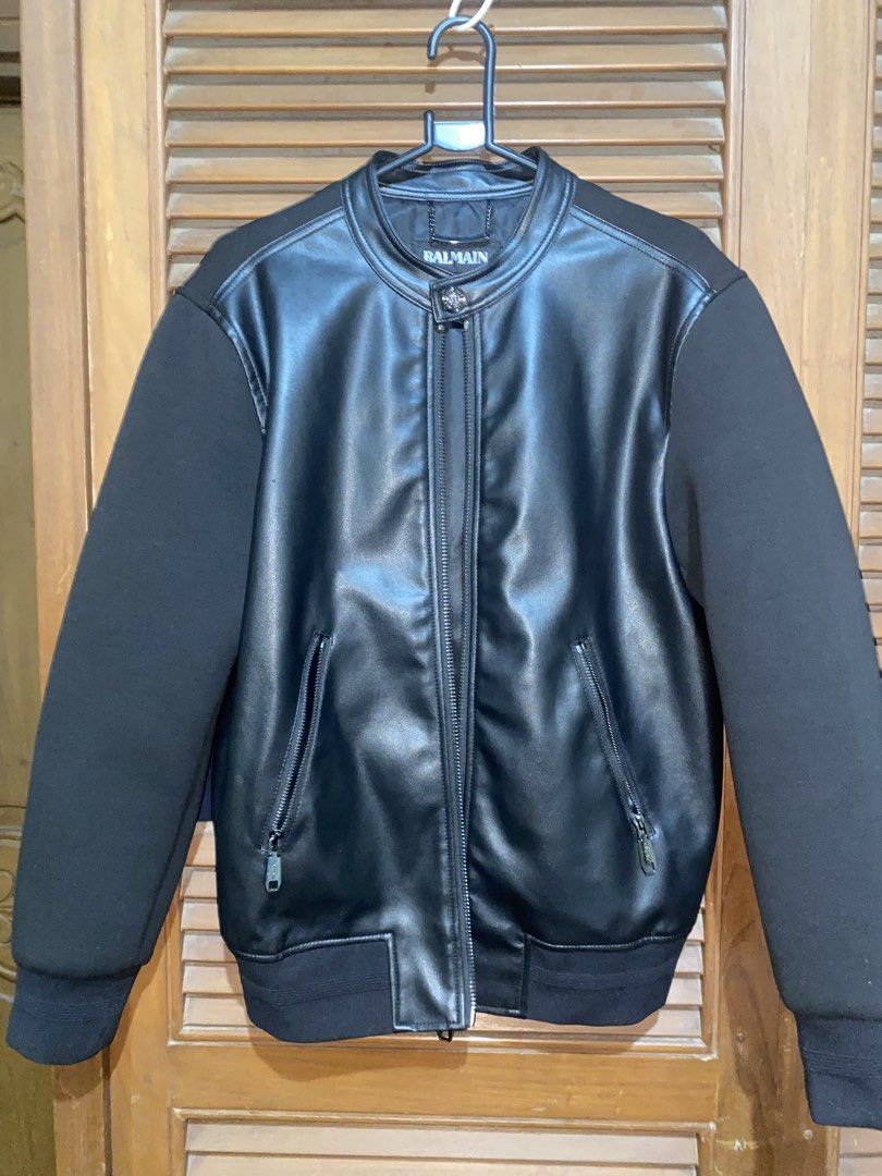 Balmain Black Faux Leather Bomber Jacket (Category: Luxury Apparel) located in Davao. Submitted by supp101 (Listing ID 1468092990, Image 1). Description: -Negotiable - Authentic Balmain bomber jacket in classic black - Faux leather body paired with soft, comfortable fabric sleeves - Full zip front closure and secure dual zipped side pockets - Stand collar with stylish top button detail - Clean interior lining with signature Balmain neck tag - Reg