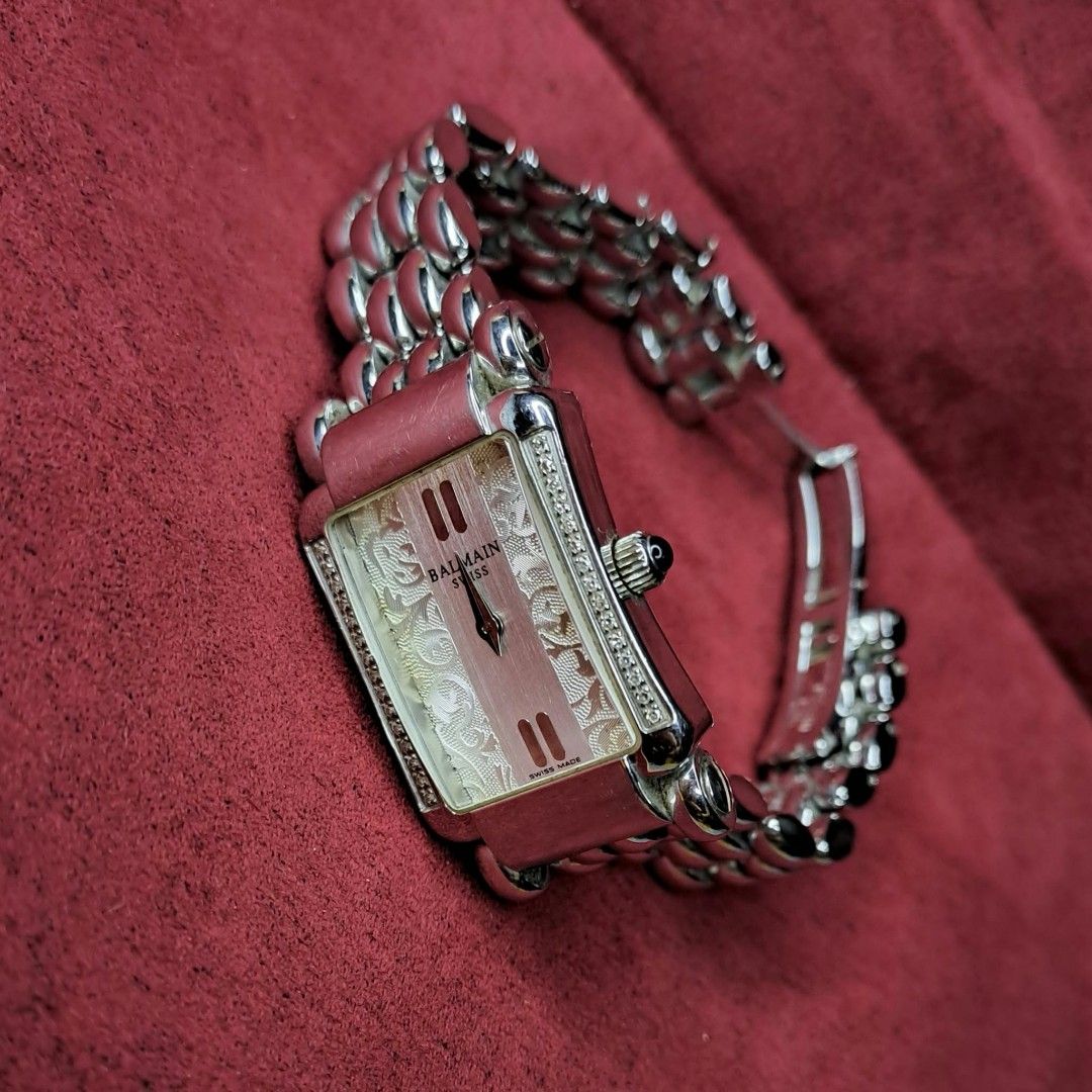 Balmain Jolie Madame Quartz (Category: Luxury Watches) located in Quezon City. Submitted by yaseen73 (Listing ID 1468271837, Image 1). Description: Pre - Owned ✔️Authentic Balmain Jolie Madame Quartz Rectangular Dress Watch (Reference B2851.33.12) Specific Details : ✔️ Balmain's Signature Central Arabesque Floral Dial Pattern & Diamond Accent Along the Bezel ✔️ The Vertical Edges of the Rectangular Bezel Are Set With a Double Row Genuine Brillian