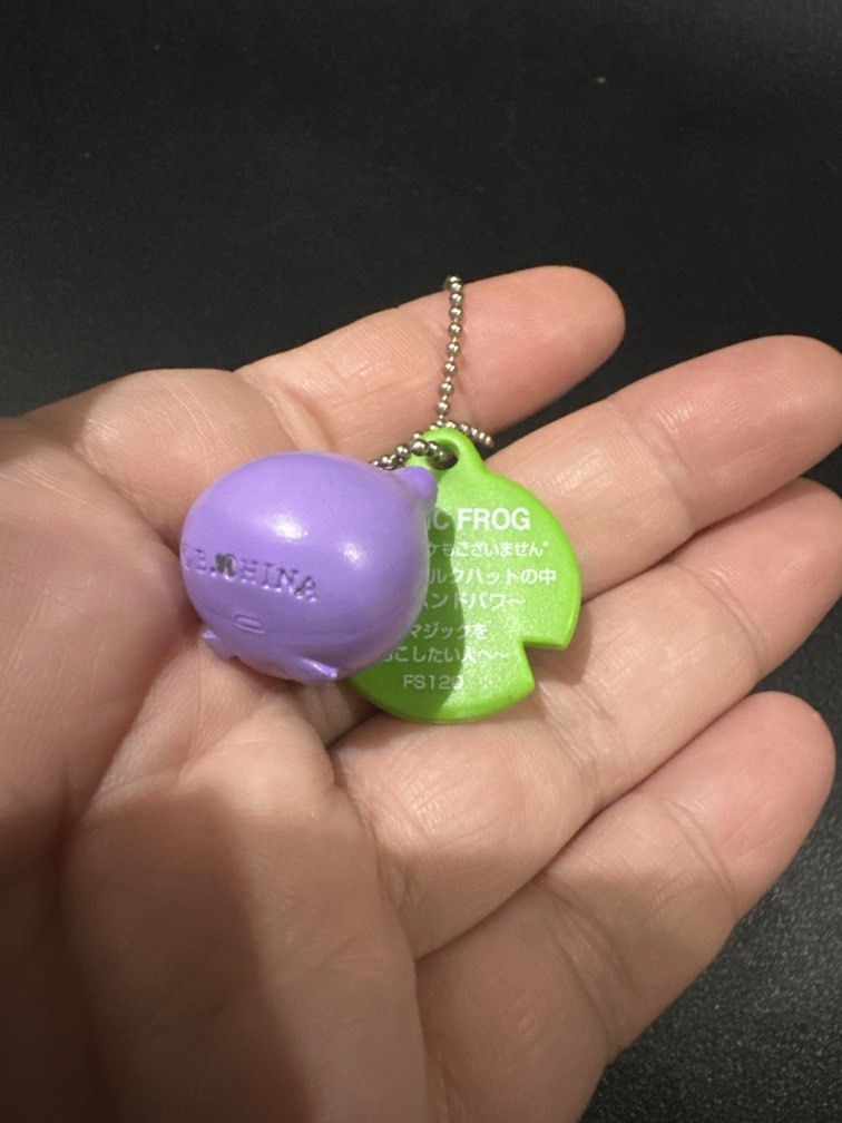 Bandai Frog Style Keychain (Category: Other Stationery & Craft) located in Manila. Submitted by krystalchewey_ (Listing ID 1468133764, Image 2). Description: Like new Actual Photo Posted 150php Magic Frog design with a purple body and a green tag.