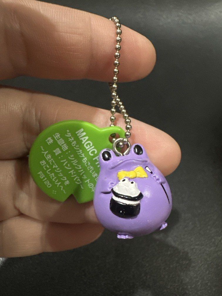 Bandai Frog Style Keychain (Category: Other Stationery & Craft) located in Manila. Submitted by krystalchewey_ (Listing ID 1468133764, Image 1). Description: Like new Actual Photo Posted 150php Magic Frog design with a purple body and a green tag.
