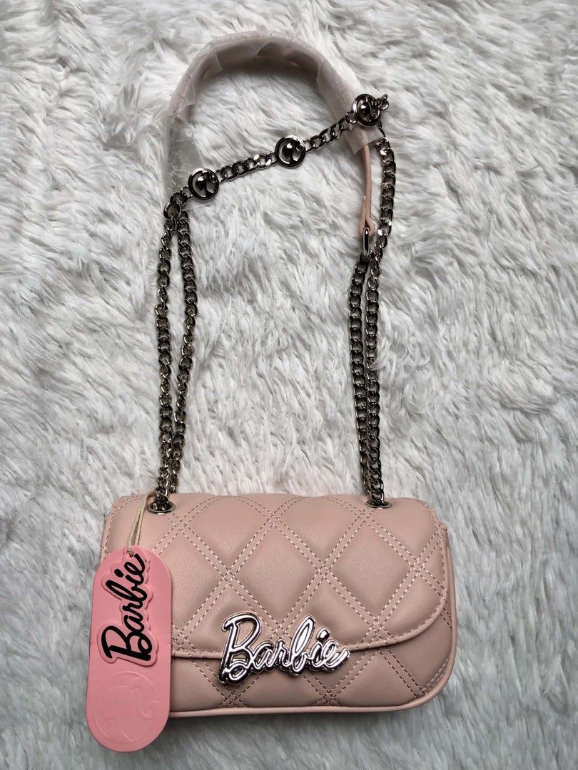 Barbie Quilted Sling Bags (Category: Cross-body Bags) located in Las Pinas. Submitted by rich.collects (Listing ID 1468257779, Image 2). Description: 🎀 Authentic Barbie Sling Bags 🎀 A little touch of elegance for your everyday looks. 🖤✨ 💖 Timeless quilted details that pair effortlessly with any outfit. 💖 Comes with a box & paper bag — perfect for gifting or treating yourself. 😉 🏷️ ₱1,800 each • ✍️ PS: Get this FOR FREE with a minimum ₱10,0