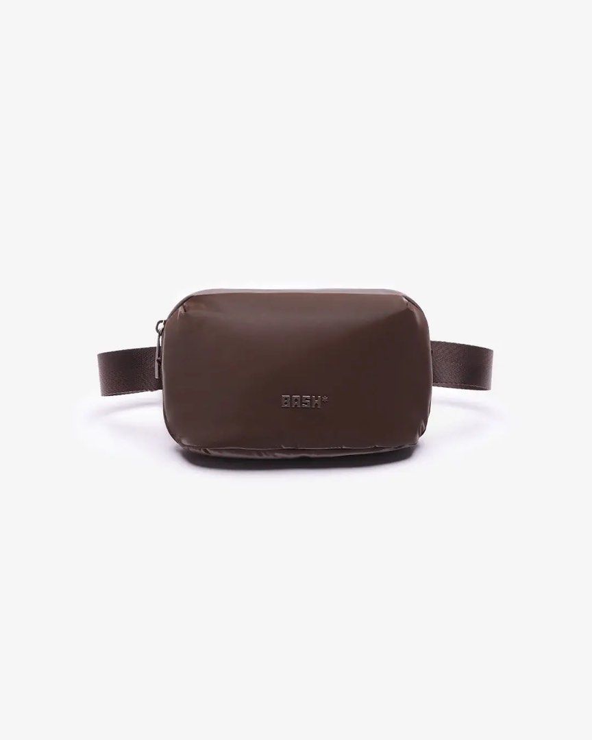 BASH* | Arc Waistpack in Terra (Category: Belt bags, Clutches and Pouches) located in Quezon City. Submitted by avenue.de.belle (Listing ID 1468240160, Image 1). Description: BASH* | Arc Waistpack in Terra Brand New with Tag DESCRIPTION Your new plus-one for every plan. The Arc Waistpack has a compact, curved shape that slips easily under outerwear or sits close to the body, with a removable waist belt and free sling strap for more ways to wear i