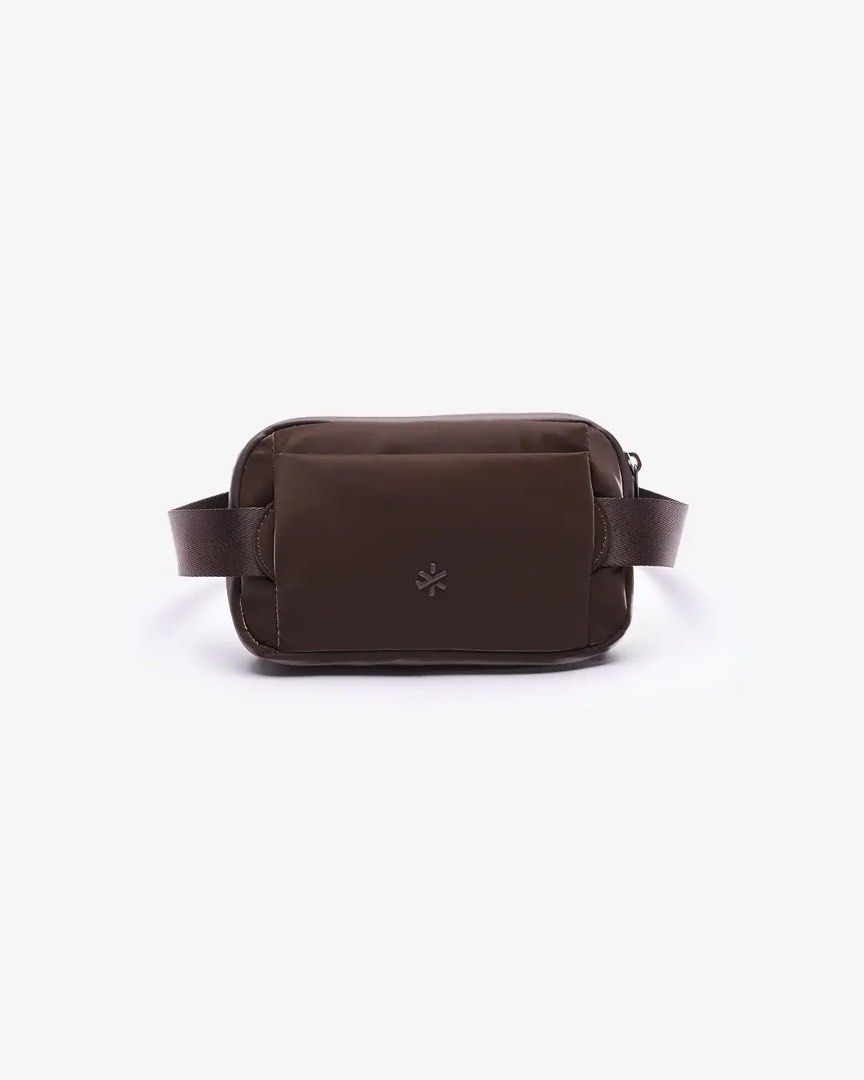 BASH* | Arc Waistpack in Terra (Category: Belt bags, Clutches and Pouches) located in Quezon City. Submitted by avenue.de.belle (Listing ID 1468240160, Image 3). Description: BASH* | Arc Waistpack in Terra Brand New with Tag DESCRIPTION Your new plus-one for every plan. The Arc Waistpack has a compact, curved shape that slips easily under outerwear or sits close to the body, with a removable waist belt and free sling strap for more ways to wear i