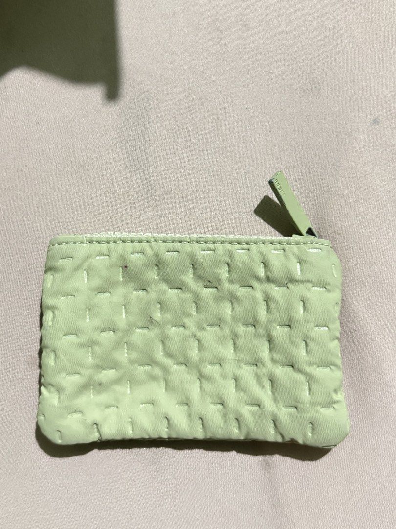 BASH Green Quilted Pouch Coin Purse (Category: Purses & Pouches) located in Tarlac. Submitted by declutterwithawd (Listing ID 1468214039, Image 2). Description: - Brand: BASH - Color: Mint green - Design: Quilted stitched pattern with metal brand plate - Closure: Smooth-working top zipper - Size: Compact, perfect for coins, cards, and small essentials - Condition: may minimal stains and paint chips sa metal parts.