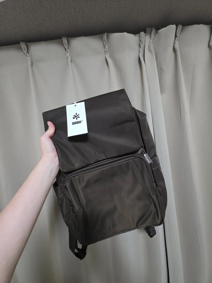 BASH Weekday Bagpack (Category: Backpacks) located in Manila. Submitted by lqvel1z (Listing ID 1468122539, Image 1). Description: WTS/LFB - Brand : BASH - Model: Weekday Backpack - Color: Terra - Condition: Great (used once) - Includes original dust bag - Bought last July lang RFS: hindi nagagamit cause bumili me ng tote bag Php 1900 only 💌 DM ME￼ .
