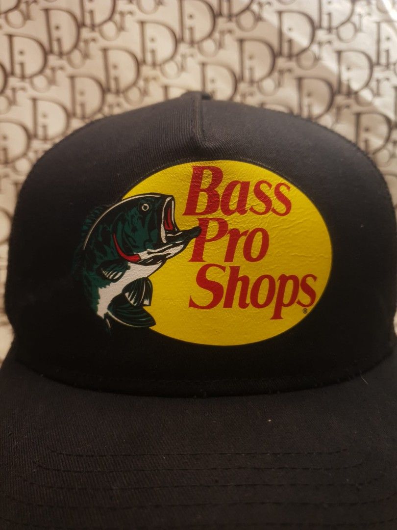 BASS PRO SHOPS BLACK TRUCKER HAT (Category: Caps & Hats) located in San Fernando. Submitted by _jaximus (Listing ID 1468218268, Image 2). Description: - Authentic Bass Pro Shops trucker hat in classic black - Iconic fish logo patch on the front - Breathable mesh back design for all-day comfort - Adjustable snapback closure fits most head sizes - Versatile solid dark color pairs easily with any outfit - Condition: Brand new / Excellent.