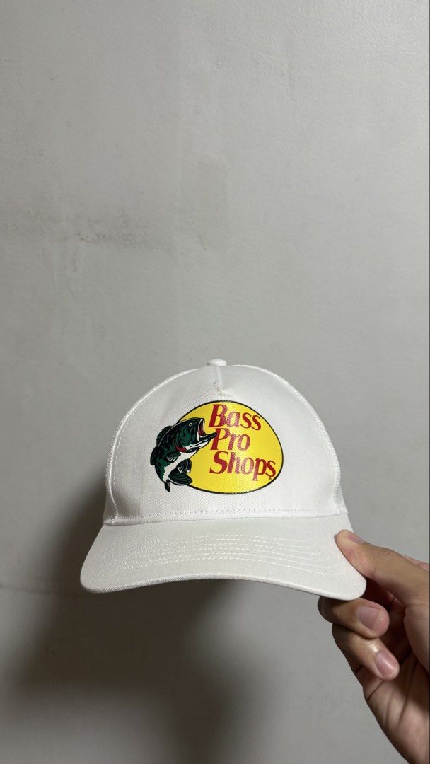Bass Pro Shops White Trucker Hat (Category: Caps & Hats) located in Quezon City. Submitted by kobeeeee_12 (Listing ID 1468146739, Image 1). Description: - Brand: Bass Pro Shops - Color: Clean White - Design: Classic bass fish logo patch on front - Style: Trucker hat with breathable mesh back panels - Fit: Adjustable snapback closure (One size fits most) - Origin: Made in Bangladesh - Condition: Inside tag and branding fully intact - Perfect for o