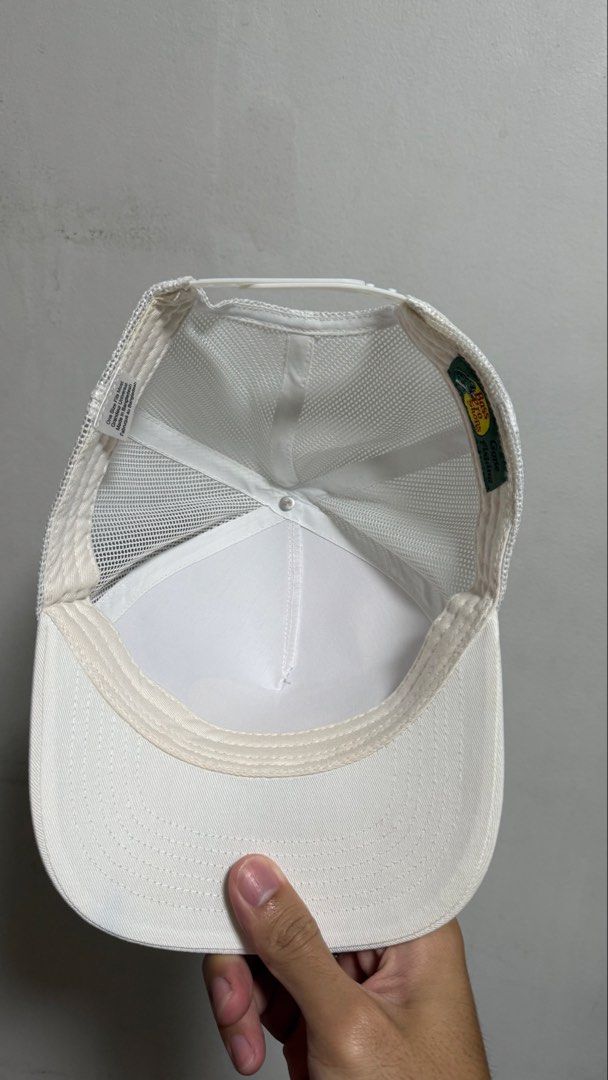 Bass Pro Shops White Trucker Hat (Category: Caps & Hats) located in Quezon City. Submitted by kobeeeee_12 (Listing ID 1468146739, Image 2). Description: - Brand: Bass Pro Shops - Color: Clean White - Design: Classic bass fish logo patch on front - Style: Trucker hat with breathable mesh back panels - Fit: Adjustable snapback closure (One size fits most) - Origin: Made in Bangladesh - Condition: Inside tag and branding fully intact - Perfect for o
