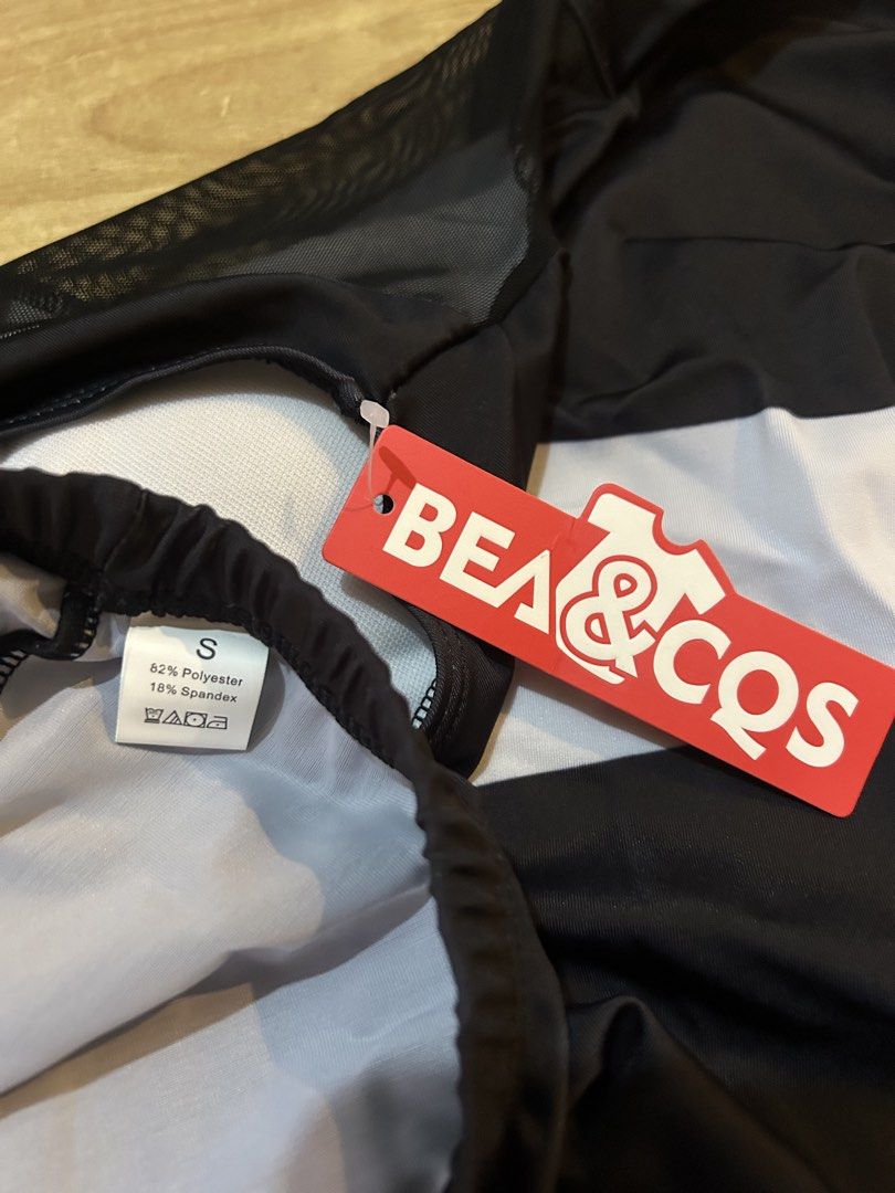 BEA & COS Black and White Two-Piece Swimsuit (Category: Bikinis & Swimsuits) located in Bulacan. Submitted by peach1025 (Listing ID 1468105381, Image 3). Description: - Condition: Brand new with red tag attached, never worn - Size: S - Style: Two-piece swimsuit with dress-style top and matching shorts - Design Details: Chic black and white pattern with stylish black mesh panels on the upper back - Material: 82% polyester, 18% spandex for a comfor