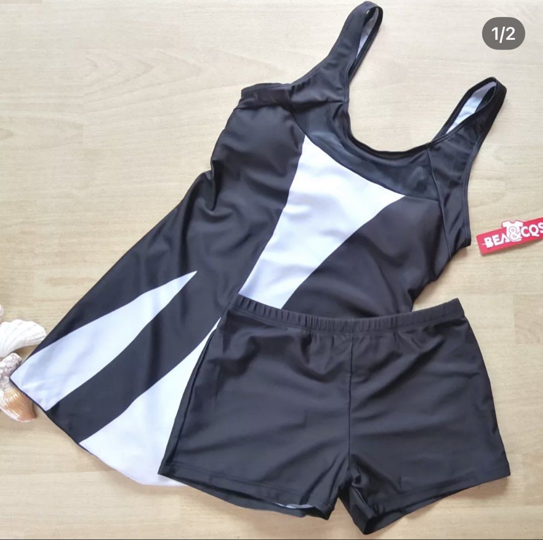 BEA & COS Black and White Two-Piece Swimsuit (Category: Bikinis & Swimsuits) located in Bulacan. Submitted by peach1025 (Listing ID 1468105381, Image 1). Description: - Condition: Brand new with red tag attached, never worn - Size: S - Style: Two-piece swimsuit with dress-style top and matching shorts - Design Details: Chic black and white pattern with stylish black mesh panels on the upper back - Material: 82% polyester, 18% spandex for a comfor