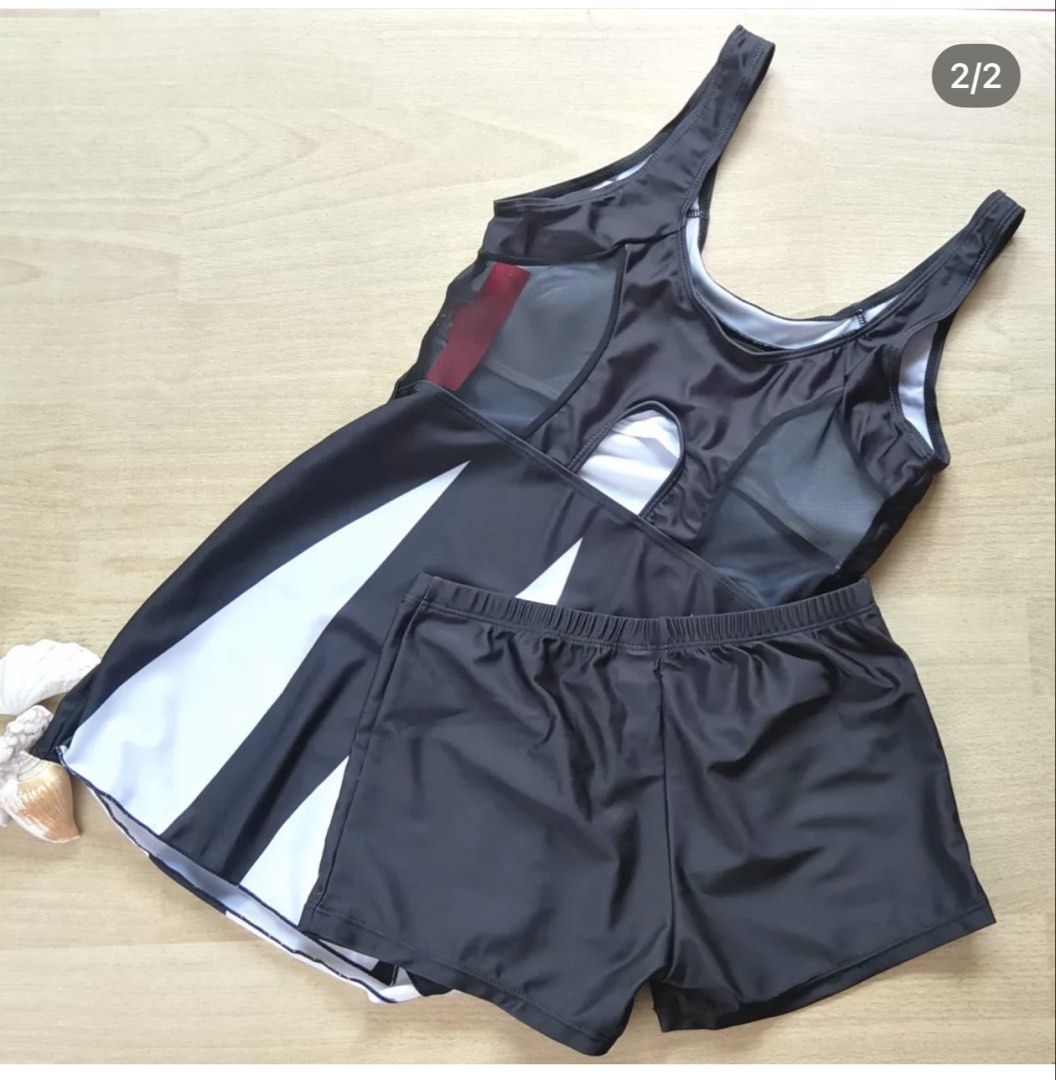 BEA & COS Black and White Two-Piece Swimsuit (Category: Bikinis & Swimsuits) located in Bulacan. Submitted by peach1025 (Listing ID 1468105381, Image 2). Description: - Condition: Brand new with red tag attached, never worn - Size: S - Style: Two-piece swimsuit with dress-style top and matching shorts - Design Details: Chic black and white pattern with stylish black mesh panels on the upper back - Material: 82% polyester, 18% spandex for a comfor