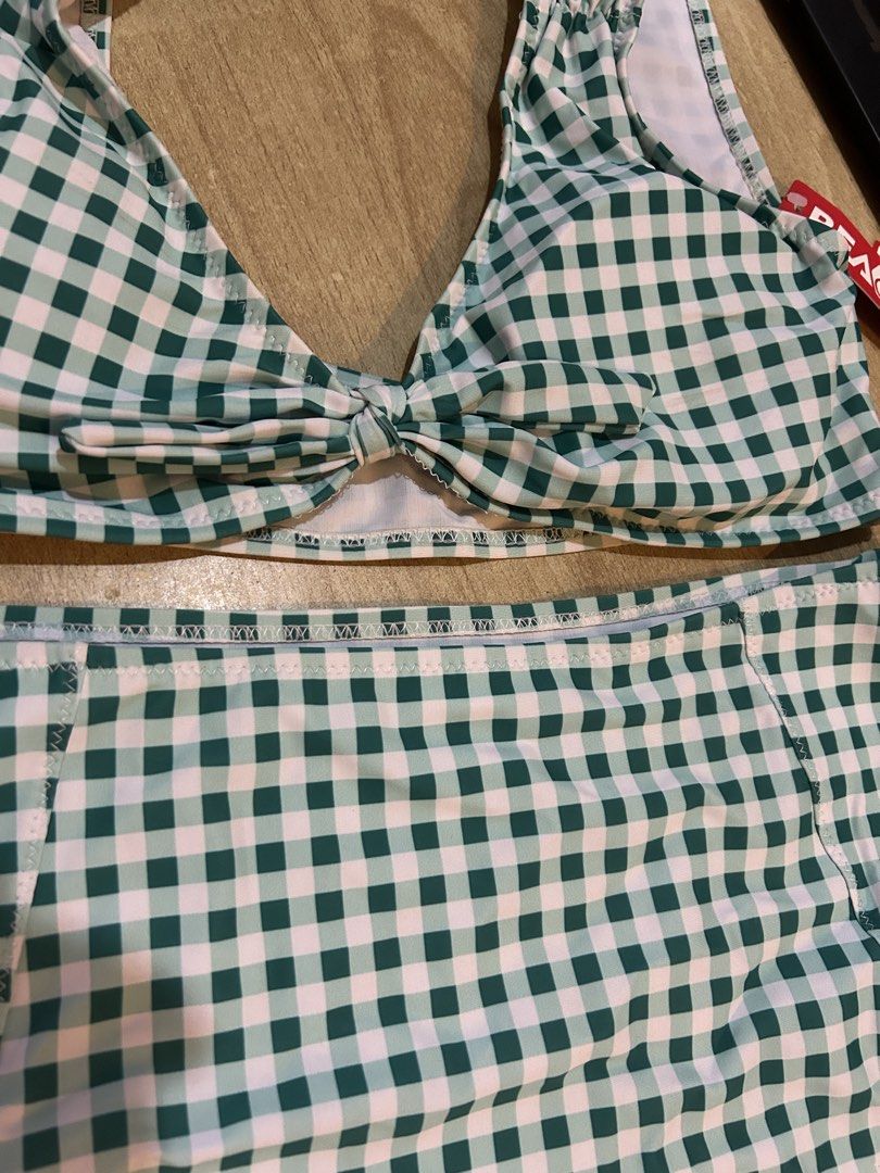 Beach & Cos Green Gingham High Waist Bikini Set (Category: Bikinis & Swimsuits) located in Bulacan. Submitted by peach1025 (Listing ID 1468104404, Image 2). Description: - Brand: Beach & Cos - Style: Green and white gingham bikini set with tie-front crop top and high-waisted bottoms - Size: L (tag attached) - Condition: Brand new, unworn with original red brand hang tag still on.