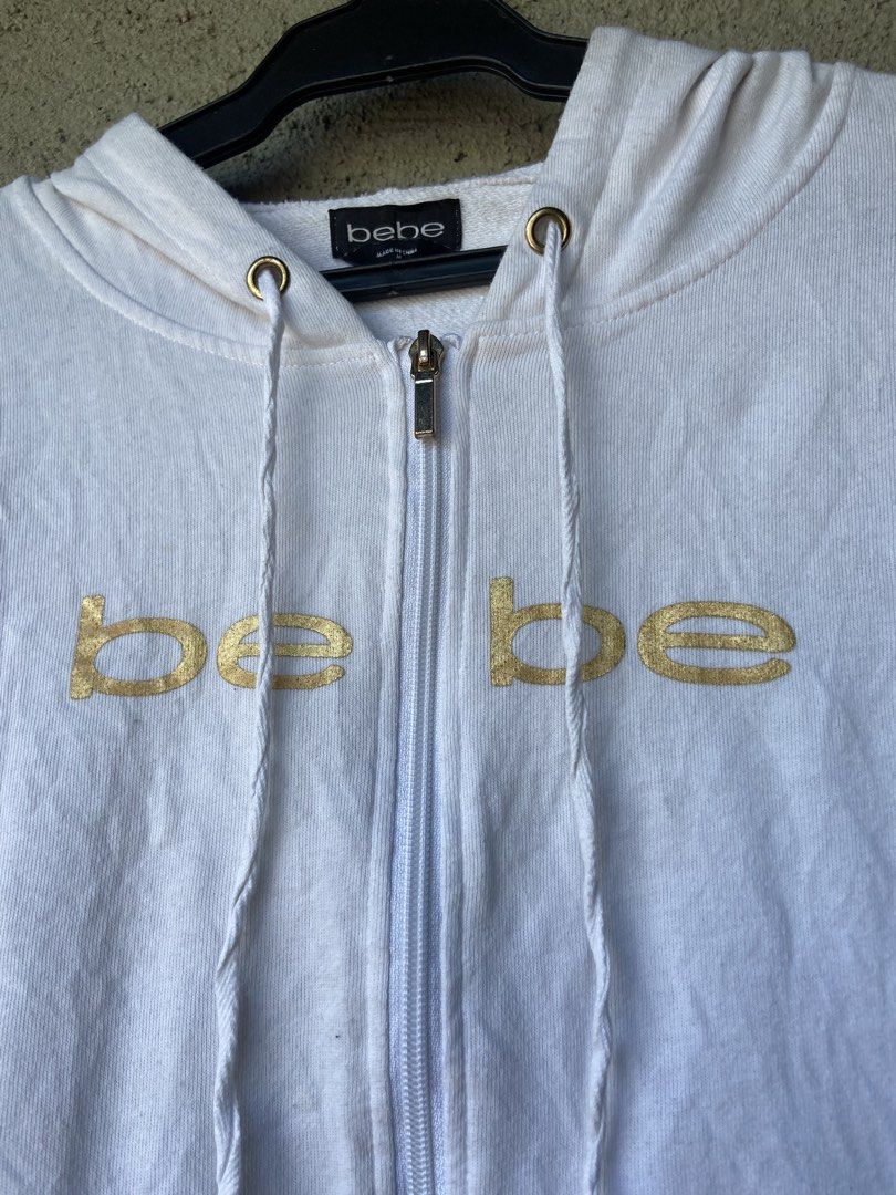 Bebe white full-zip hoodie jacket (Category: Coats, Jackets and Outerwear) located in Cavite. Submitted by abasolo_jv (Listing ID 1468134824, Image 3). Description: Good Condition 9.8/10 Color rate Need wash m on tag 20x22 Dimes fresh from bale try to offer .