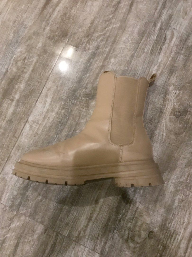 Beige Chunky Chelsea Boots Platform Lug Sole (Category: Boots) located in Manila. Submitted by sparkfinds (Listing ID 1468242528, Image 1). Description: - Color: Versatile neutral beige - Style: Chunky Chelsea boots with a bold platform lug sole - Design: Slip-on with stretch elastic side panels and back pull tabs - Height: Comfortable mid-calf fit - Traction: Sturdy tread for a secure grip - Pairing: Perfect match for any casual or edgy outfit.