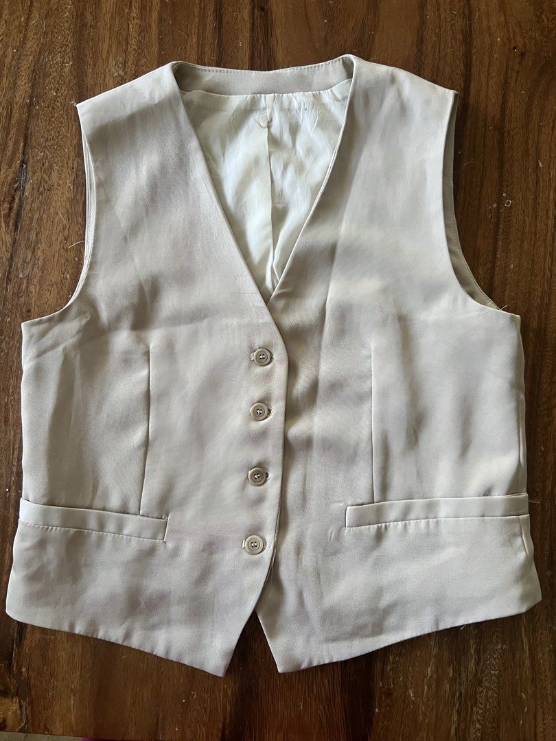 Beige tailored vest (Category: Sleeveless) located in Angeles City. Submitted by msr093 (Listing ID 1468113037, Image 1). Description: - Color: Beige - Style: Tailored waistcoat with clean lines - Closure: Four front buttons - Lining: Fully lined with white fabric .