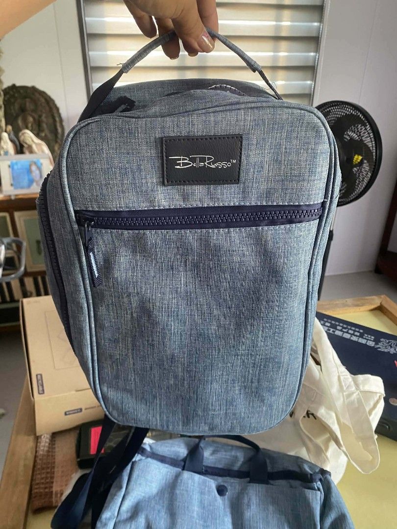 Bella Russo Blue Heathered Travel Backpack (Category: Backpacks) located in Zaragoza. Submitted by sherree1281 (Listing ID 1468282661, Image 1). Description: - Brand: Bella Russo - Color: Blue heathered - Material: Sturdy fabric throughout - Features: Dark blue front zipper closure and matching top handle - Bonus: Includes a matching smaller bag underneath - Condition: Excellent / Brand new.