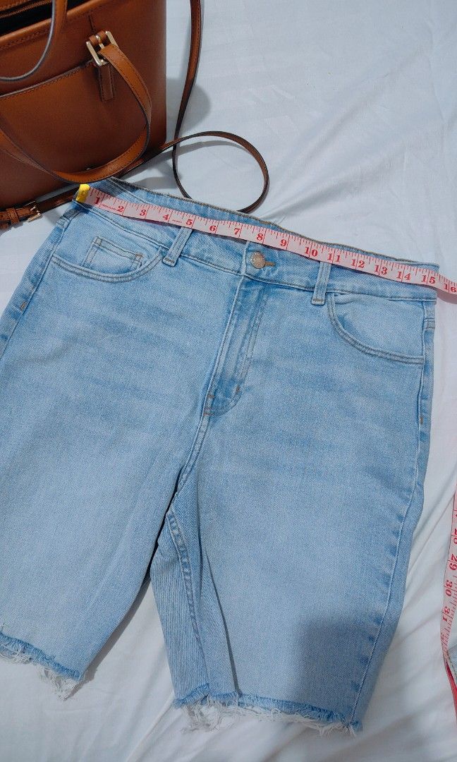 Bershka Light Wash Denim Shorts (Category: Shorts) located in Bacolor. Submitted by annjjjjj (Listing ID 1468079433, Image 2). Description: - Brand: Bershka - Style: High-waisted denim shorts with raw hem - Color: Light wash - Details: Classic five-pocket design, button closure - Condition: Great, clean with no flaws - Perfect for: Everyday casual and warm weather wear.