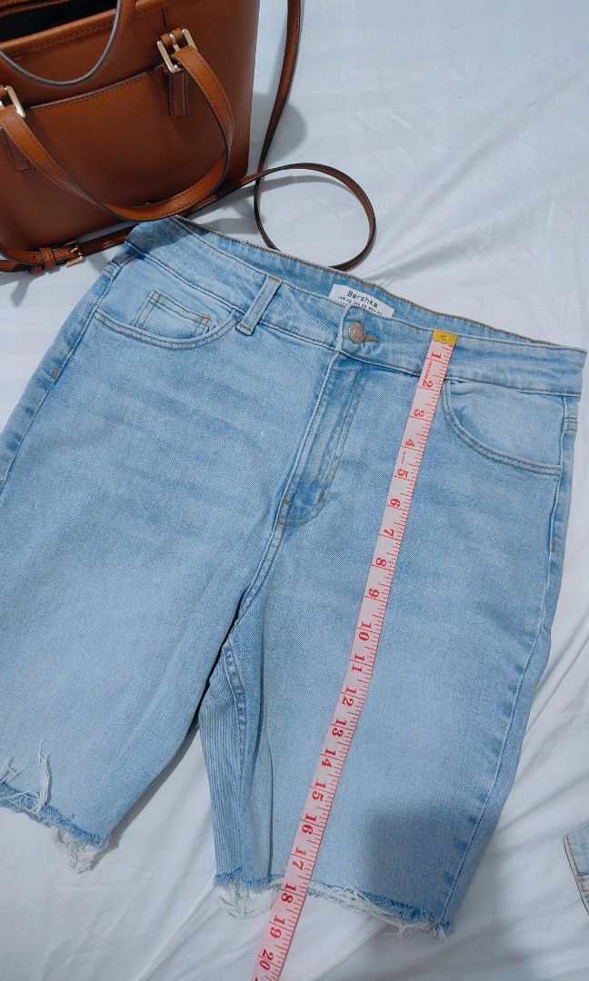 Bershka Light Wash Denim Shorts (Category: Shorts) located in Bacolor. Submitted by annjjjjj (Listing ID 1468079433, Image 3). Description: - Brand: Bershka - Style: High-waisted denim shorts with raw hem - Color: Light wash - Details: Classic five-pocket design, button closure - Condition: Great, clean with no flaws - Perfect for: Everyday casual and warm weather wear.