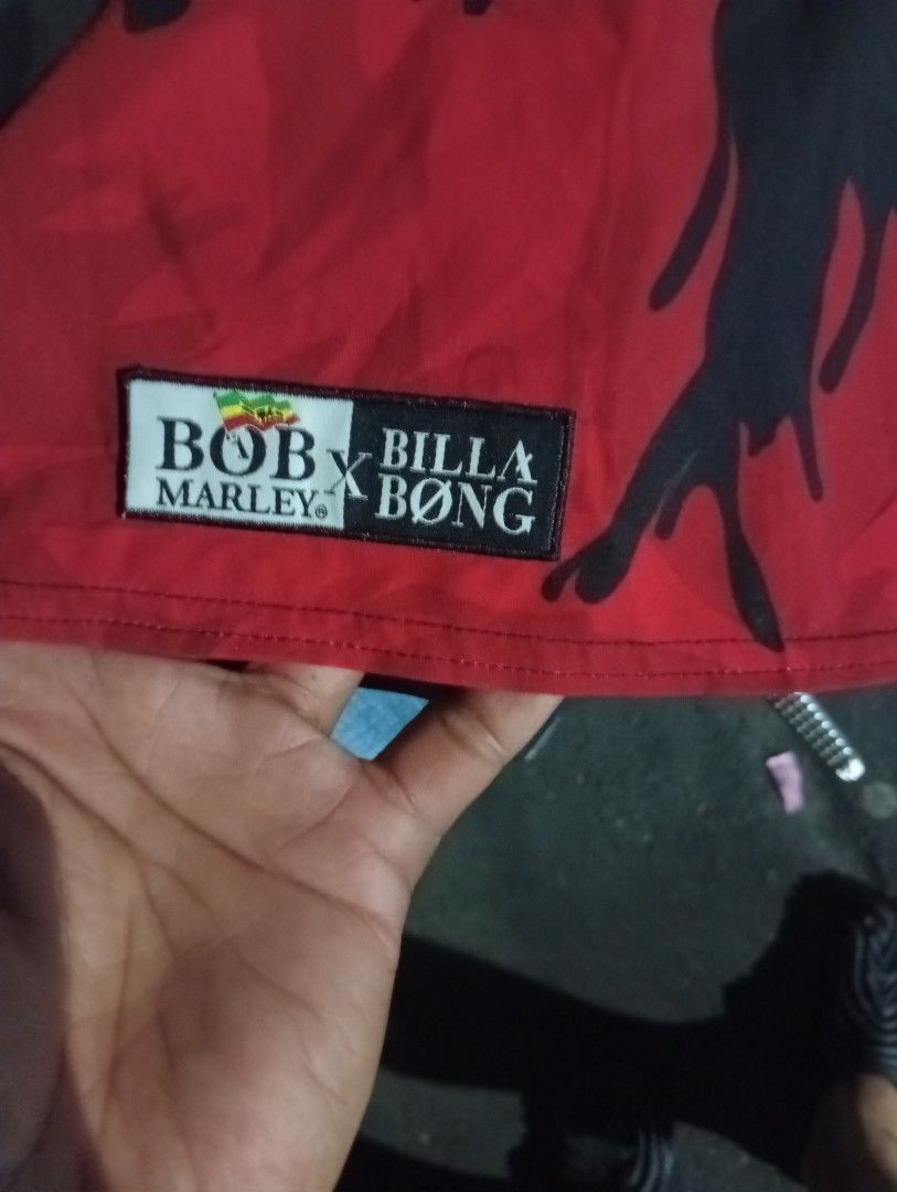 Billabong x Bob Marley Board Shorts (Category: Swim Trunks & Board Shorts) located in Quezon City. Submitted by asu06 (Listing ID 1468188437, Image 3). Description: - Brand: Billabong x Bob Marley - Size: 34 - Colorway: Iconic Rastafari stripes (green, yellow, red) - Design: Large Bob Marley graphic on the right leg - Material: Recycler series (88% recycled polyester, 12% spandex) - Features: Secure drawstring waist with branded hardware - Origin