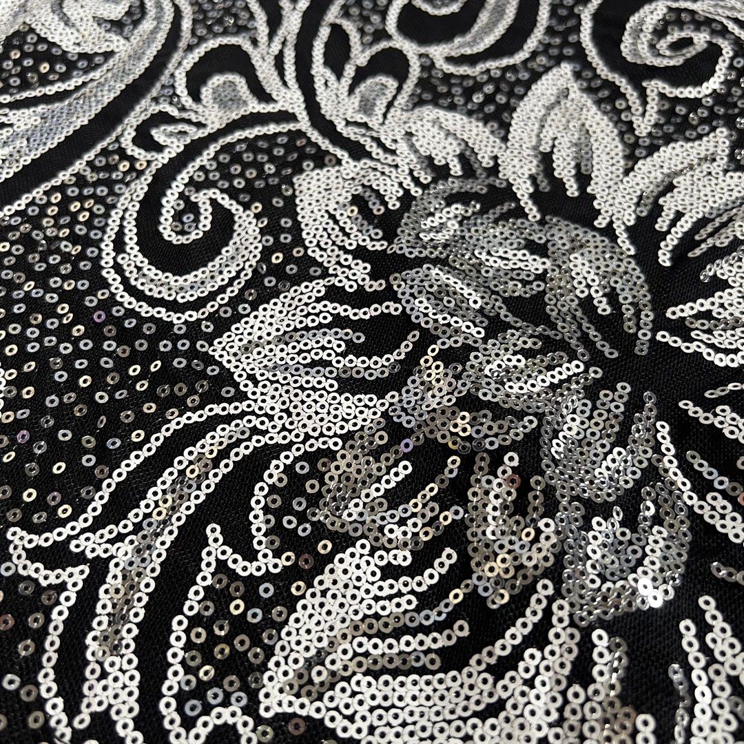 Black and Silver Sequin Floral Short Sleeve Top (Category: Shirts) located in Manila. Submitted by threadly (Listing ID 1468232649, Image 2). Description: - Color/Design: Black with all-over silver sequins in a floral and paisley pattern - Fit & Style: Round neckline, cap sleeves, stretchy and comfortable fabric - Details: Catches the light beautifully for a high-impact sparkly look - Styling: Great party piece, easily pairs with jeans or a skirt