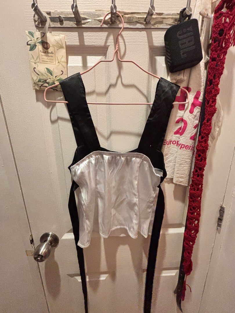 Black and White Satin Top (Category: Sleeveless) located in Valenzuela. Submitted by sasha2802 (Listing ID 1468201112, Image 2). Description: SHEIN EZwear satin tank top. Black wide straps and upper bodice, white lower body. Scoop neck design. Tie back ribbons attached at the sides Never worn out. closet declutter sale.