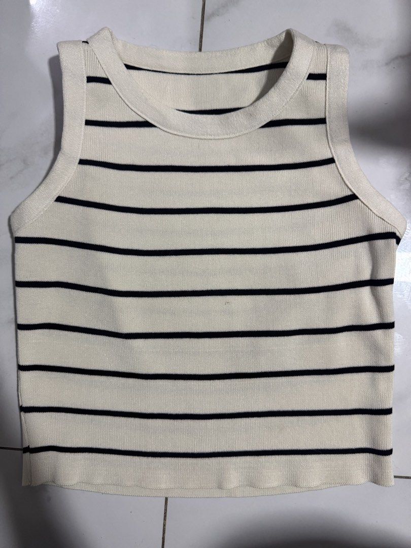 Black and White Striped Ribbed Tank Top (Category: Sleeveless) located in Manila. Submitted by decluterthings888 (Listing ID 1468226673, Image 1). Description: - Color: Black and white stripes - Style: Classic scoop neckline, sleeveless - Fabric: Stretchy ribbed knit that hugs the body - Versatility: Great for layering or wearing on its own - Condition: Brand new / Excellent quality - Mode of Payment: GCash, BPI, or COD available - Shipping: Fast