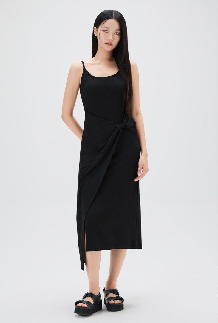 Black Draped Twisted Side Cotton Maxi Dress (Category: Dresses) located in Binan City. Submitted by myprelovedhaul (Listing ID 1468077474, Image 2). Description: Heavy thick fabric, adjustable strap fits xs to medium The image shows a black spaghetti-strap dress with a draped, twisted side detail.