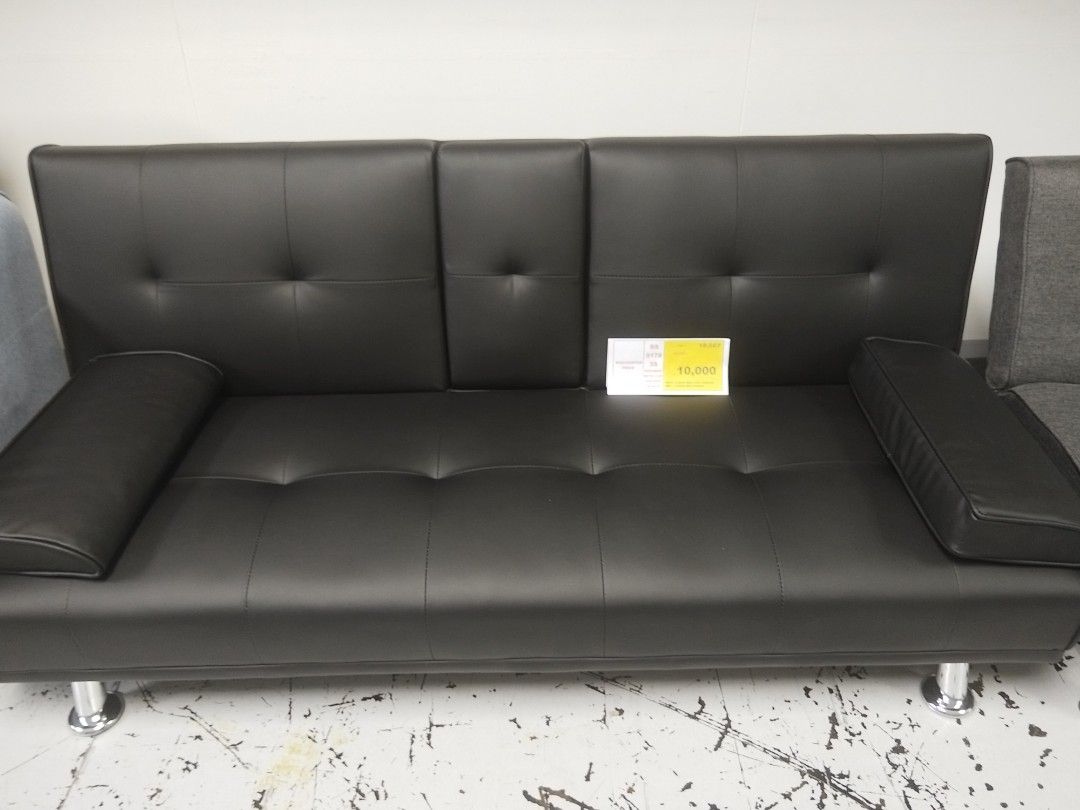 Black Faux Leather Sofa Bed with Chrome Legs (Category: Sofas) located in Manila. Submitted by zealdragon.930c01 (Listing ID 1468112699, Image 1). Description: - Sleek black faux leather sofa bed with a modern design - Easily converts into a comfortable bed for guests - Stylish tufted backrest and sturdy chrome metal legs - Includes 2 matching arm pillows - Solid and durable build, ideal for living rooms or guest rooms - Condition: Clean surface 