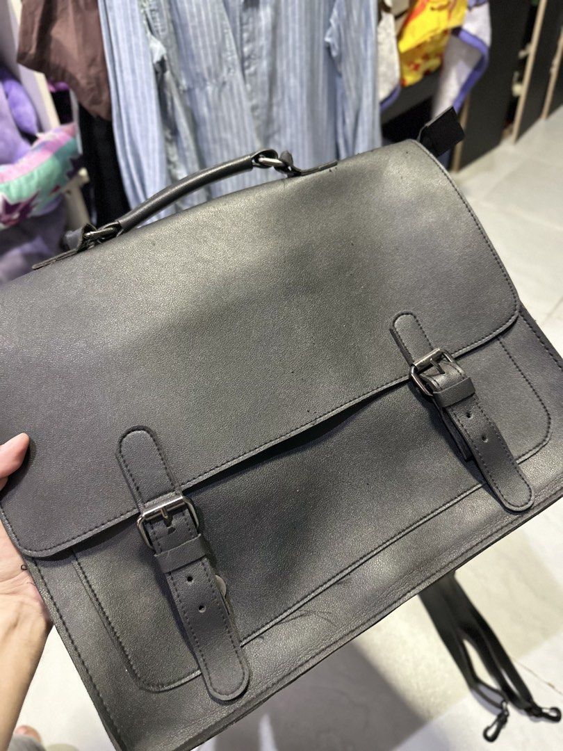 Black Leather Satchel Briefcase Convertible Backpack (Category: Sling Bags) located in Makati City. Submitted by its.ptrck (Listing ID 1468115979, Image 3). Description: - Style: (converts from messenger to backpack) - Closure: Flap with hidden magnetic snaps under decorative dual buckles - Comfort & Carry: Top handle and adjustable shoulder straps with rear D-rings - Storage: Convenient front slip pocket under the main flap - Versatility: Perfec